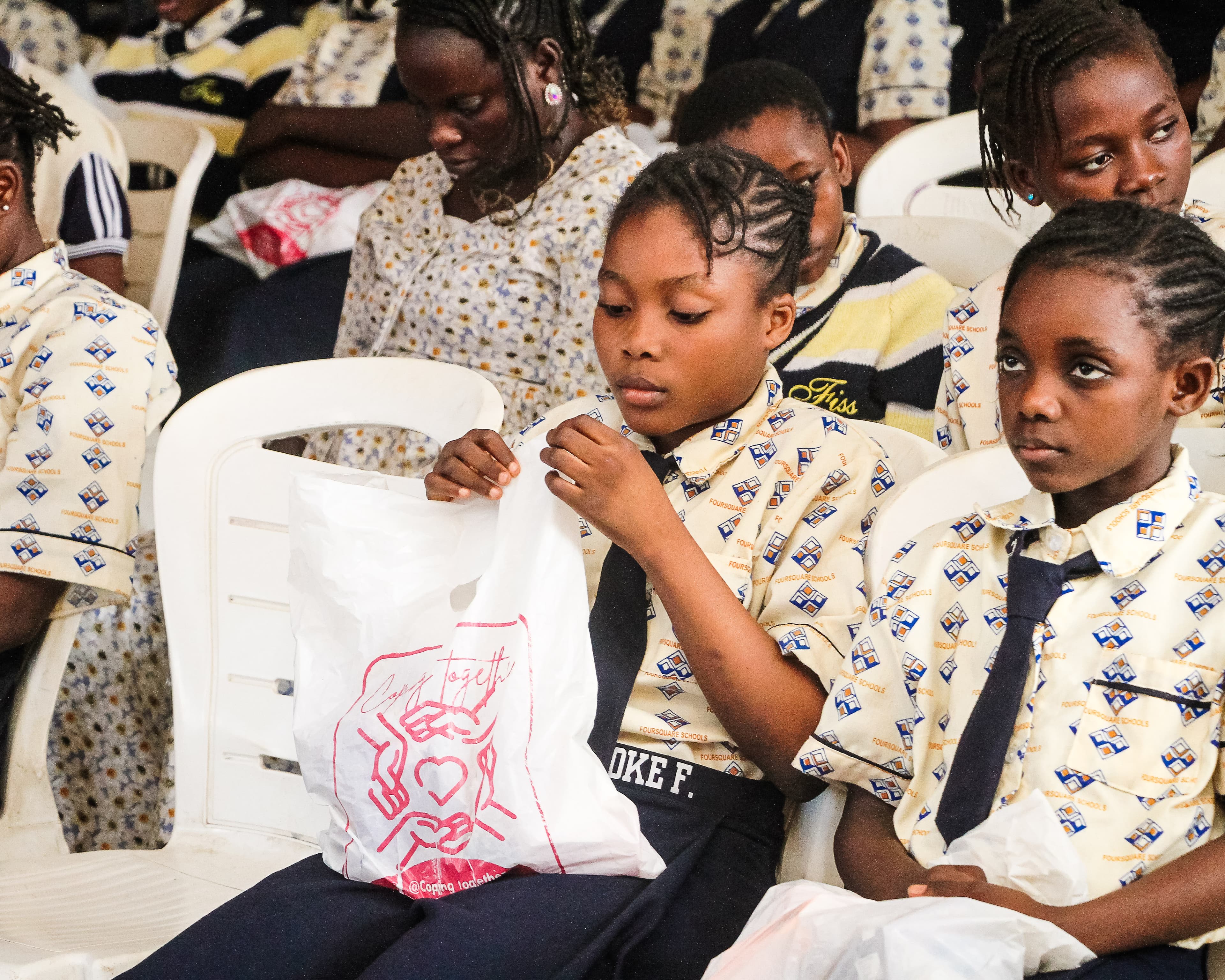 A student having a sneaky look at the care pack.